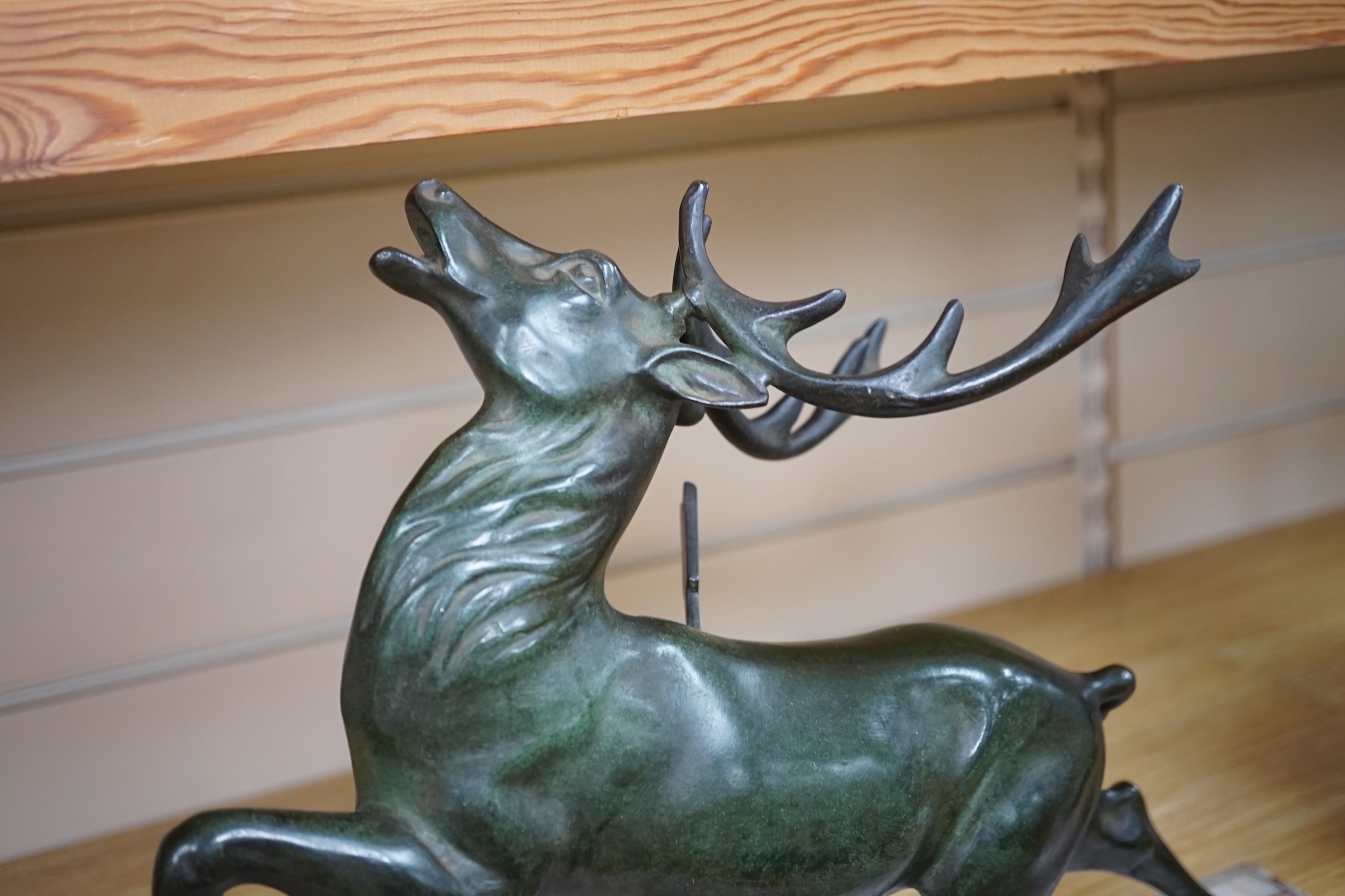 A bronze model of a stag raised on rectangular marble base, 45cm wide. Condition - good